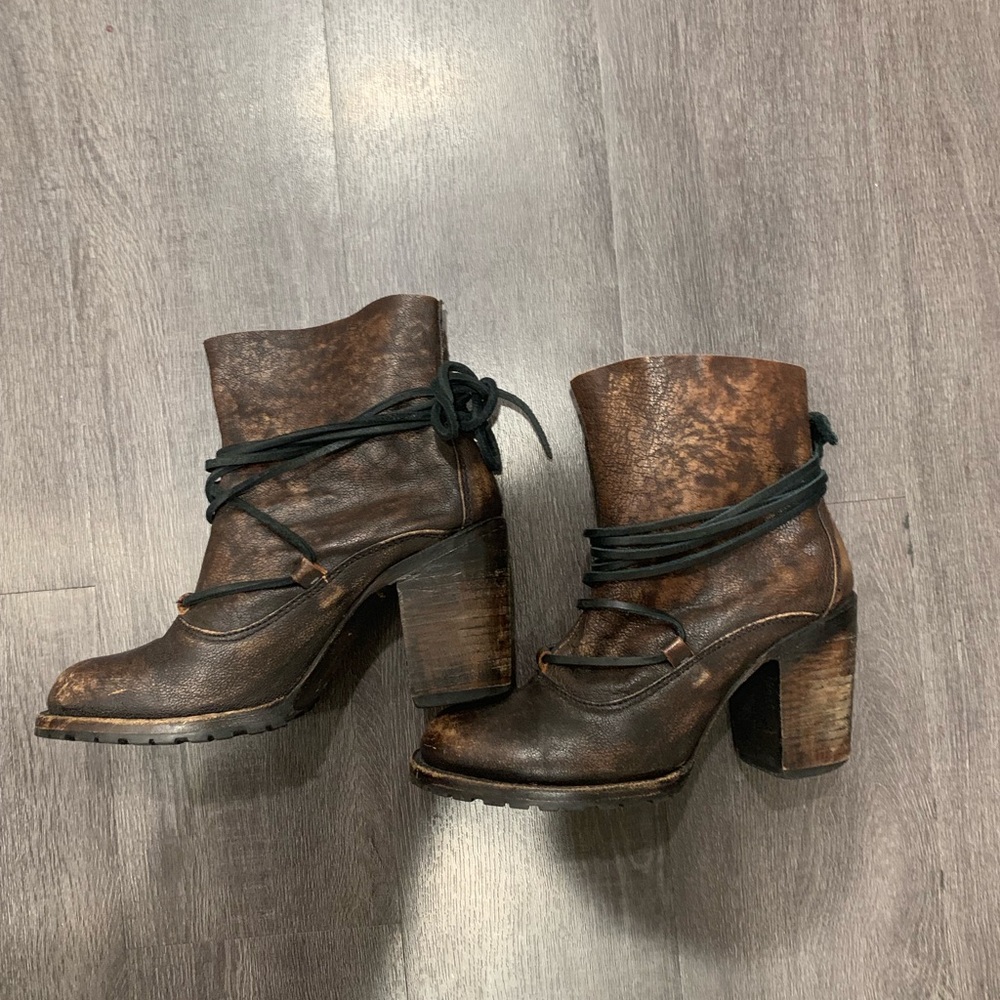 Heeled distressed leather boots